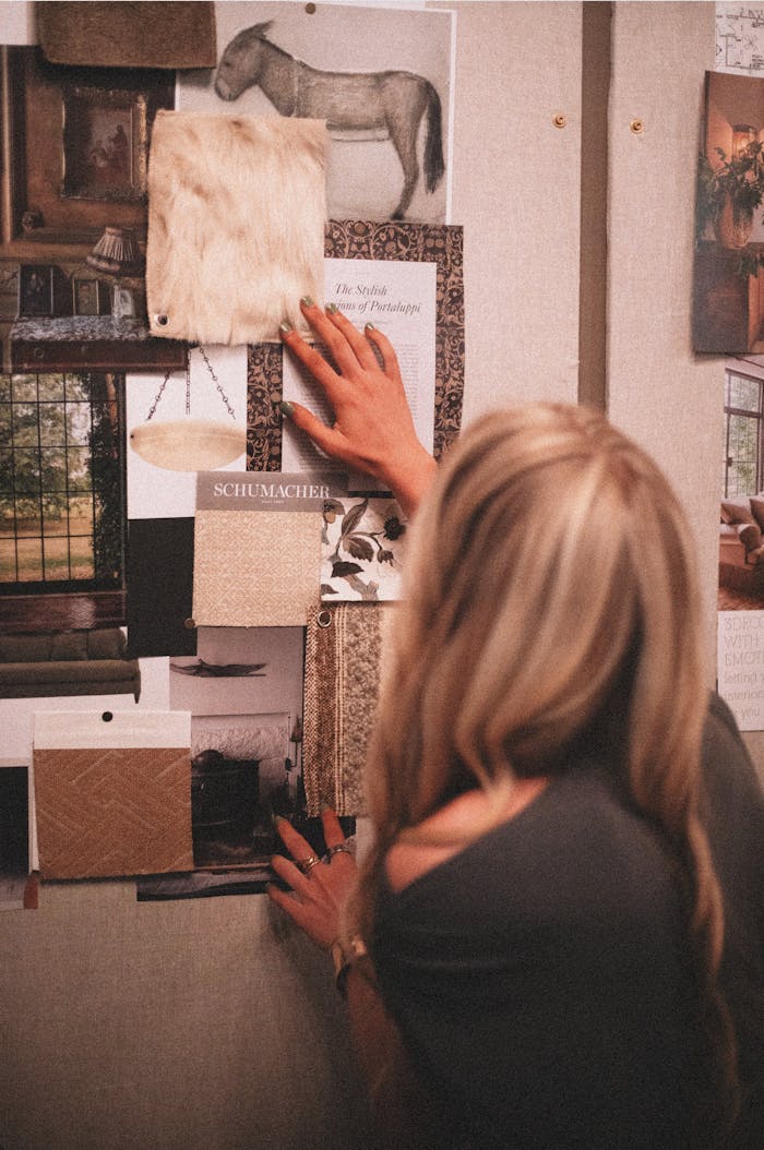 Woman arranging samples on a mood board for interior design inspiration.