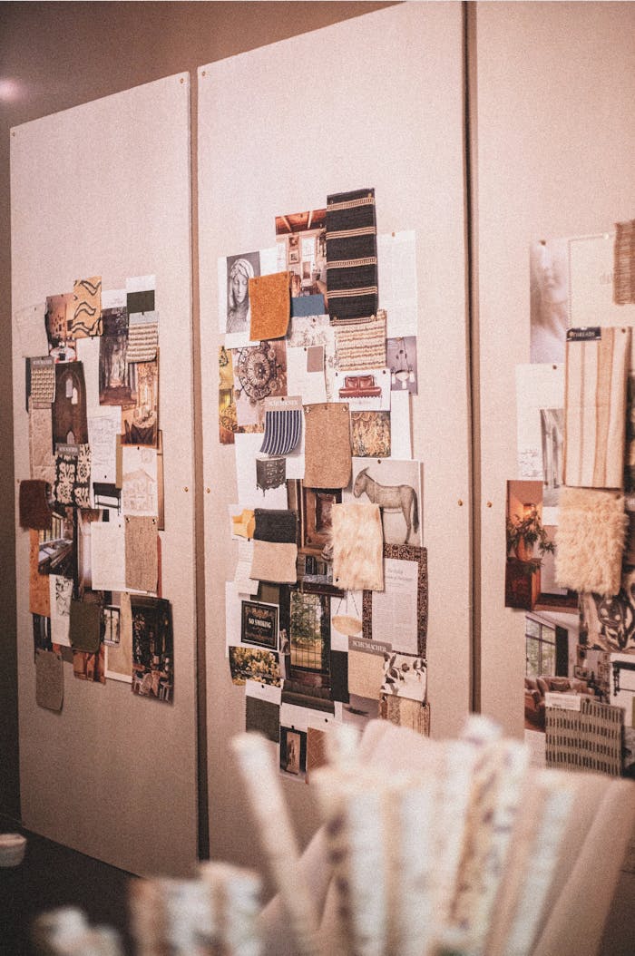 Stylish mood boards showcasing textures and patterns in a modern interior design studio.